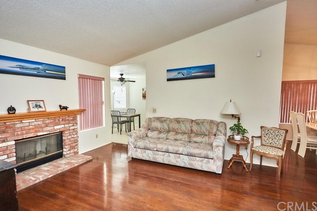 471 Silverado Street Barstow, CA 92311 - Photo 11 of 43 a living room with furniture and a fireplace