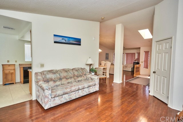 471 Silverado Street Barstow, CA 92311 - Photo 12 of 43 a living room with furniture and a wooden floor
