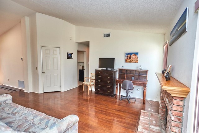 471 Silverado Street Barstow, CA 92311 - Photo 13 of 43 a living room with furniture and a wooden floor