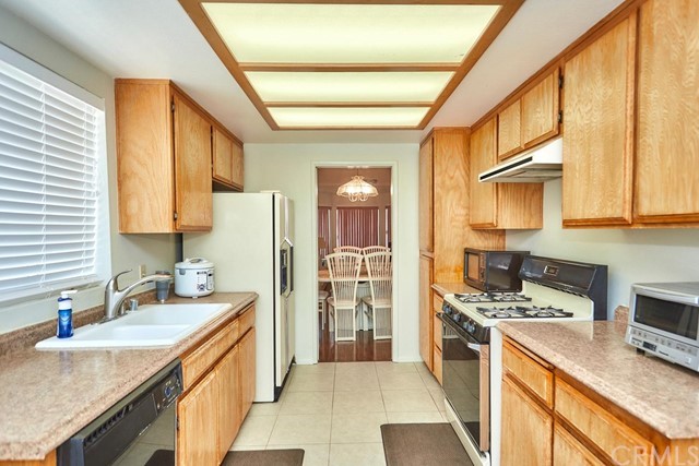 471 Silverado Street Barstow, CA 92311 - Photo 15 of 43 a kitchen with stainless steel appliances granite countertop a sink stove and refrigerator