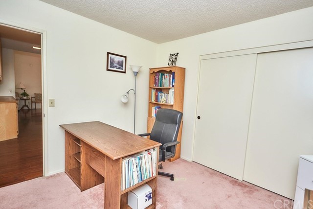 471 Silverado Street Barstow, CA 92311 - Photo 22 of 43 a view of a hallway with workspace