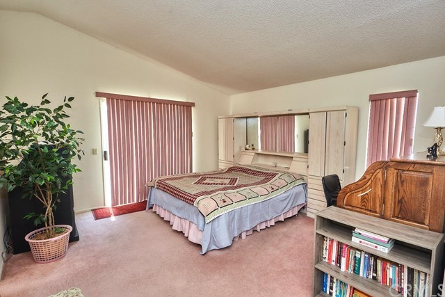 471 Silverado Street Barstow, CA 92311 - Photo 27 of 43 a living room with furniture and a potted plant