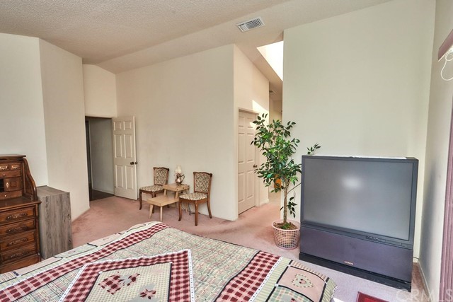 471 Silverado Street Barstow, CA 92311 - Photo 29 of 43 a living room with furniture and a potted plant