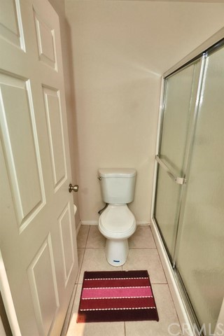 471 Silverado Street Barstow, CA 92311 - Photo 32 of 43 a bathroom with a toilet and a shower