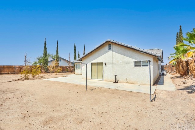 471 Silverado Street Barstow, CA 92311 - Photo 35 of 43 a view of a house with a yard