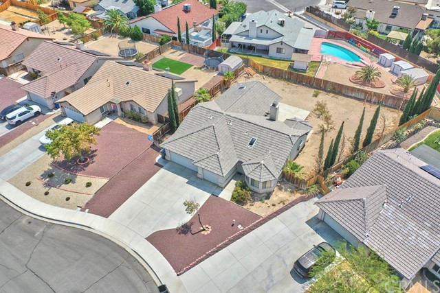 471 Silverado Street Barstow, CA 92311 - Photo 41 of 43 an aerial view of a house with a yard and greenery