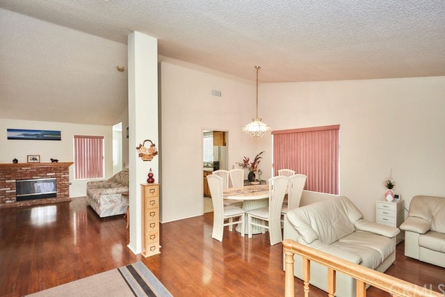 471 Silverado Street Barstow, CA 92311 - Photo 6 of 43 a view of a livingroom with furniture and wooden floor