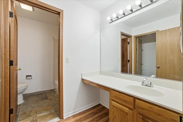 a bathroom with a sink a mirror and a shower