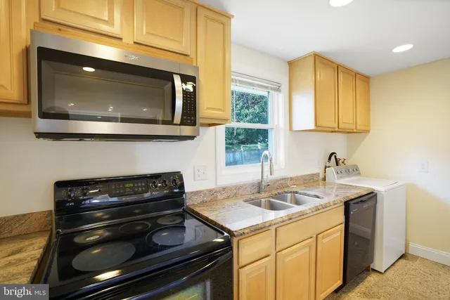 a kitchen with a stove and a microwave