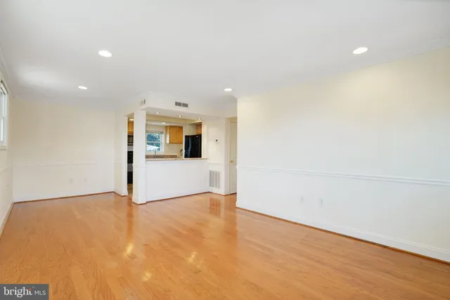 a view of a kitchen with wooden floor