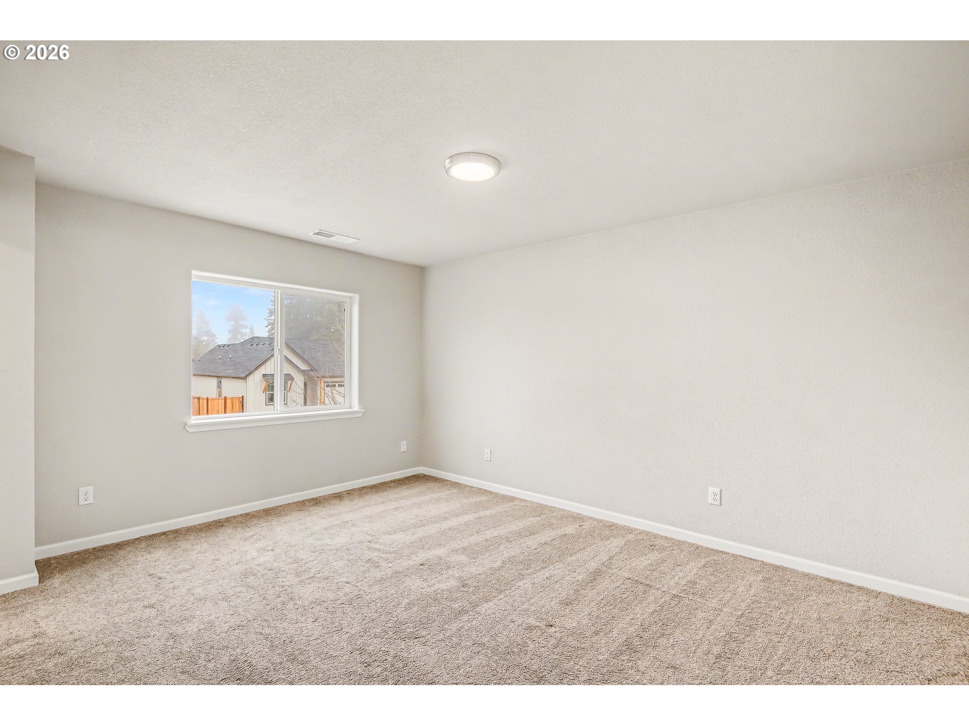 88192 Jameson Way Veneta, OR 97487 - Photo 12 of 44 a view of an empty room with a window