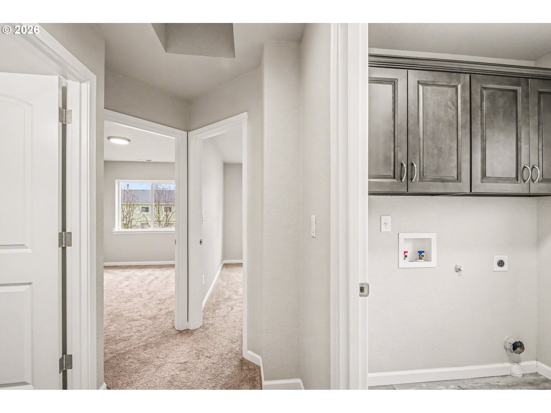 88192 Jameson Way Veneta, OR 97487 - Photo 23 of 44 a view of a hallway with wooden cabinet