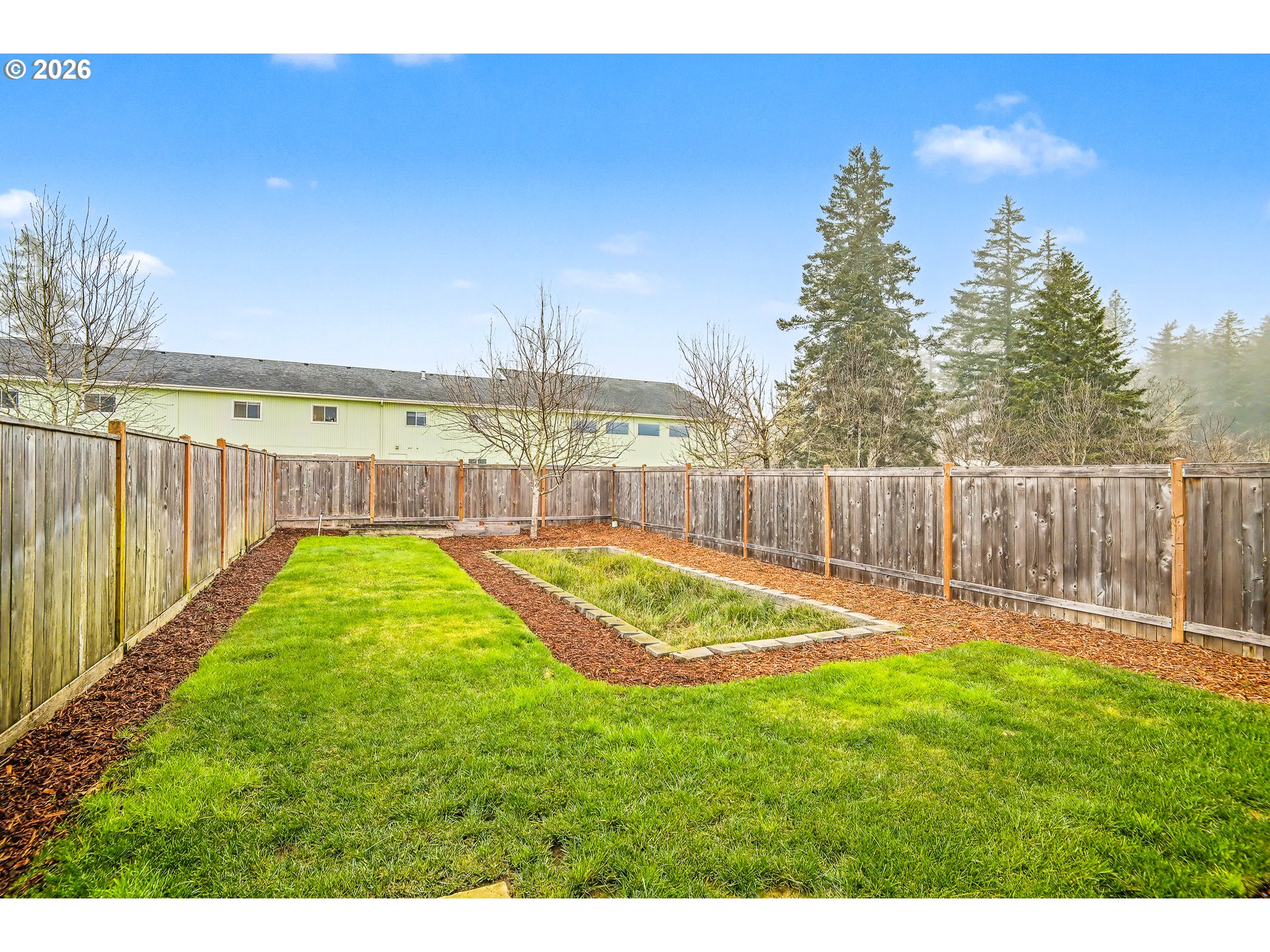 88192 Jameson Way Veneta, OR 97487 - Photo 25 of 44 a view of a backyard with a garden