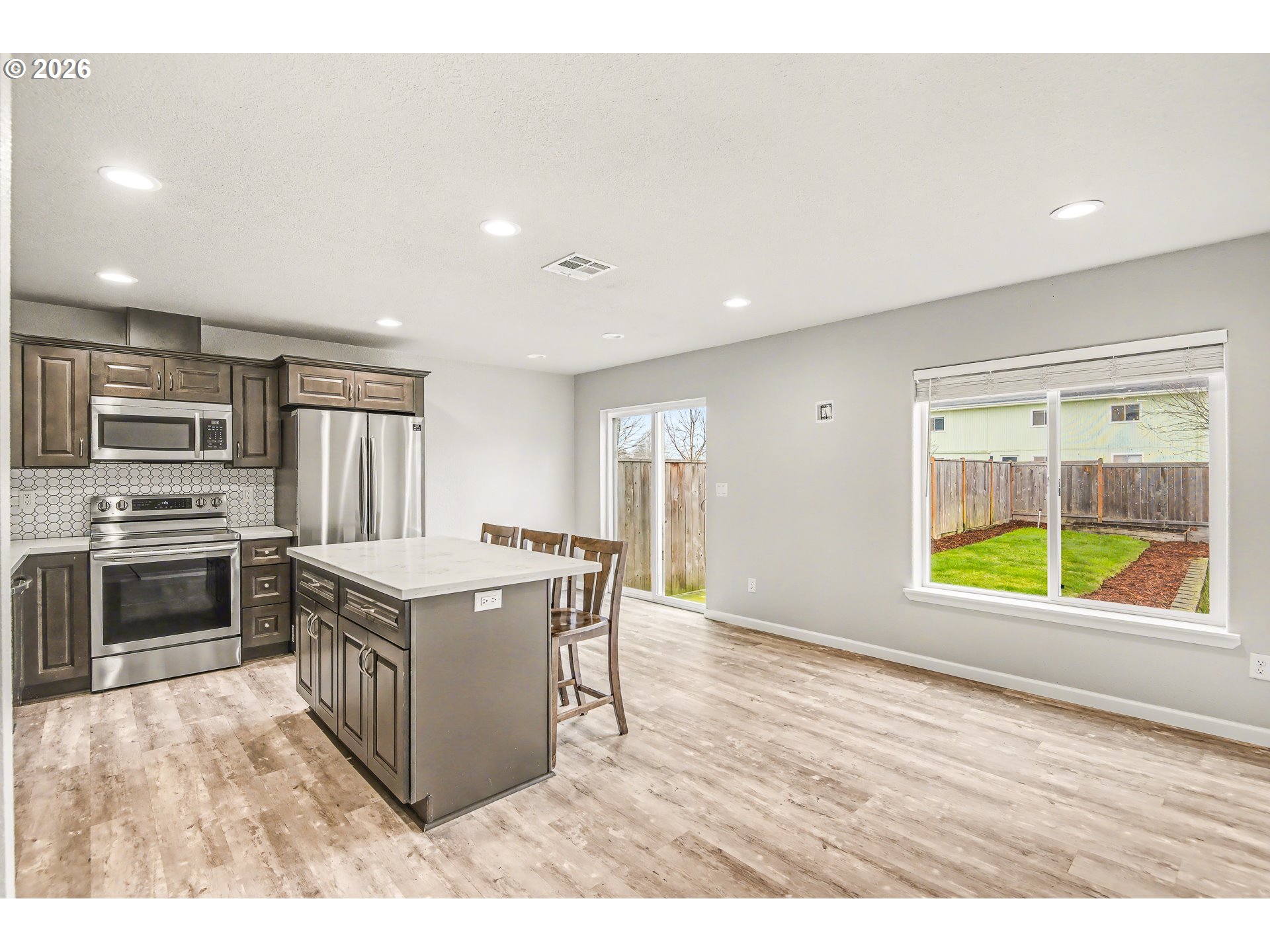 88192 Jameson Way Veneta, OR 97487 - Photo 8 of 44 a kitchen with stainless steel appliances granite countertop a stove top oven