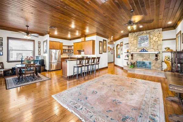 a bathroom with a tub a sink and a window