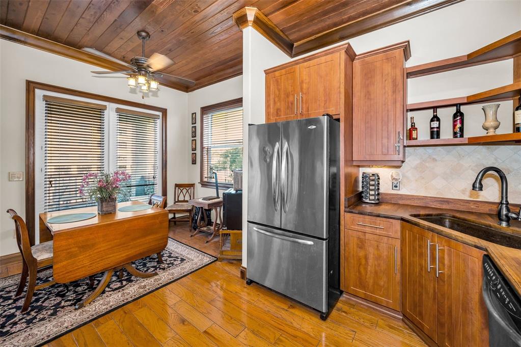 6141 Lafayette Street New Port Richey, FL 34652 - Photo 19 of 98 a kitchen with stainless steel appliances granite countertop a refrigerator a stove and a sink
