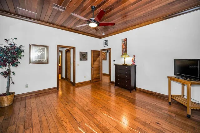 an aerial view of residential houses with outdoor space and parking