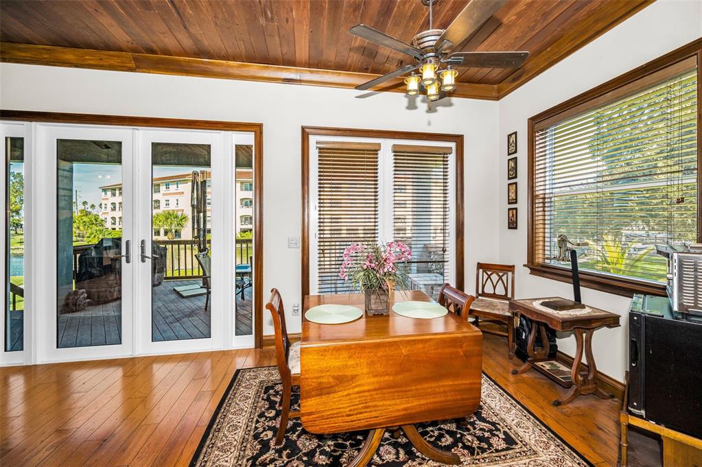 6141 Lafayette Street New Port Richey, FL 34652 - Photo 21 of 98 a room with patio furniture and a floor to ceiling window