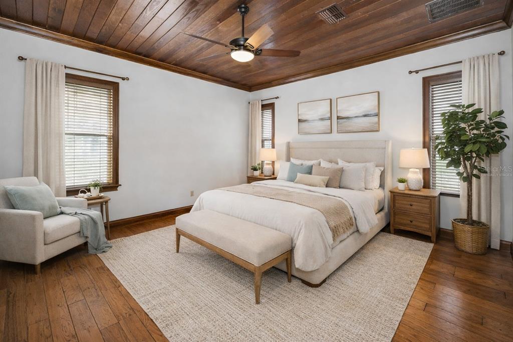 6141 Lafayette Street New Port Richey, FL 34652 - Photo 24 of 98 a bedroom with a large bed and a couch