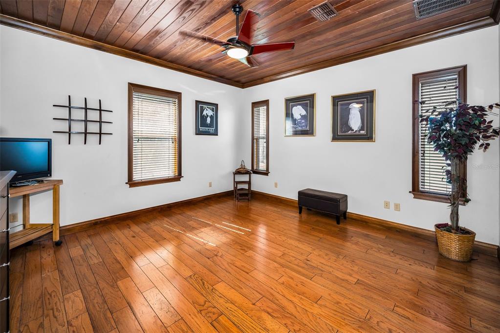 6141 Lafayette Street New Port Richey, FL 34652 - Photo 25 of 98 a view of an empty room with window and wooden floor
