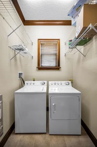 a front view of a house with yard and green space