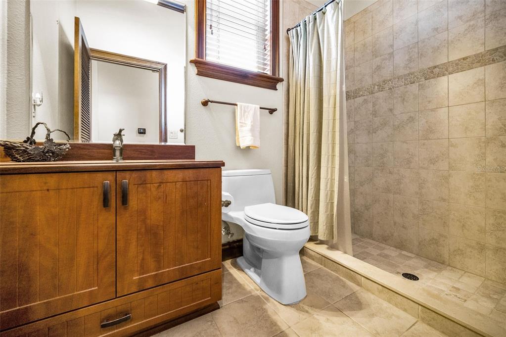 6141 Lafayette Street New Port Richey, FL 34652 - Photo 33 of 98 a bathroom with a toilet a sink and shower