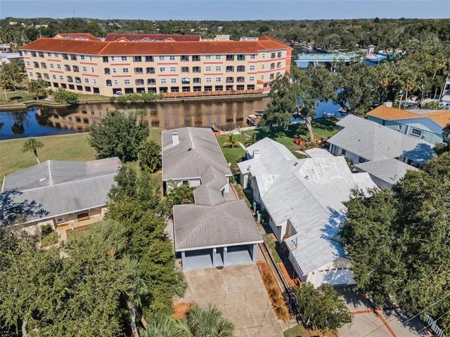an aerial view of residential houses with outdoor space