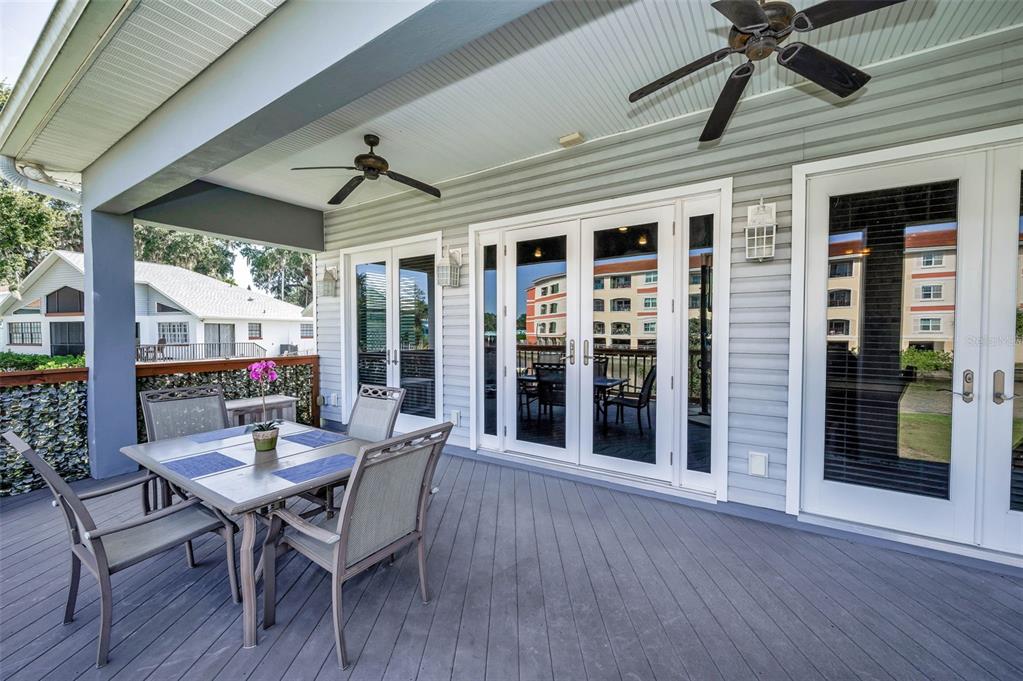 6141 Lafayette Street New Port Richey, FL 34652 - Photo 39 of 98 a dining room with wooden floor and outdoor space