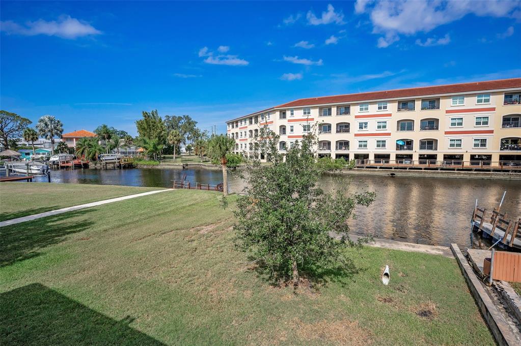 6141 Lafayette Street New Port Richey, FL 34652 - Photo 40 of 98 a view of swimming pool with outdoor seating and lake view