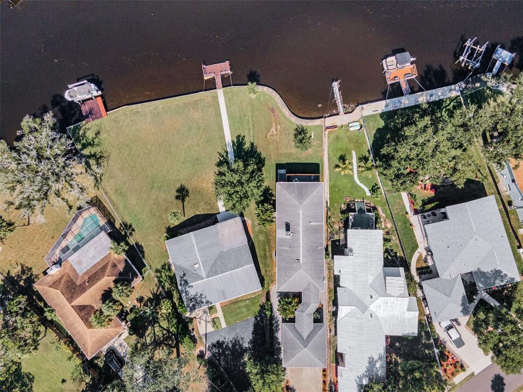 6141 Lafayette Street New Port Richey, FL 34652 - Photo 59 of 98 an aerial view of a house with a yard and large tree