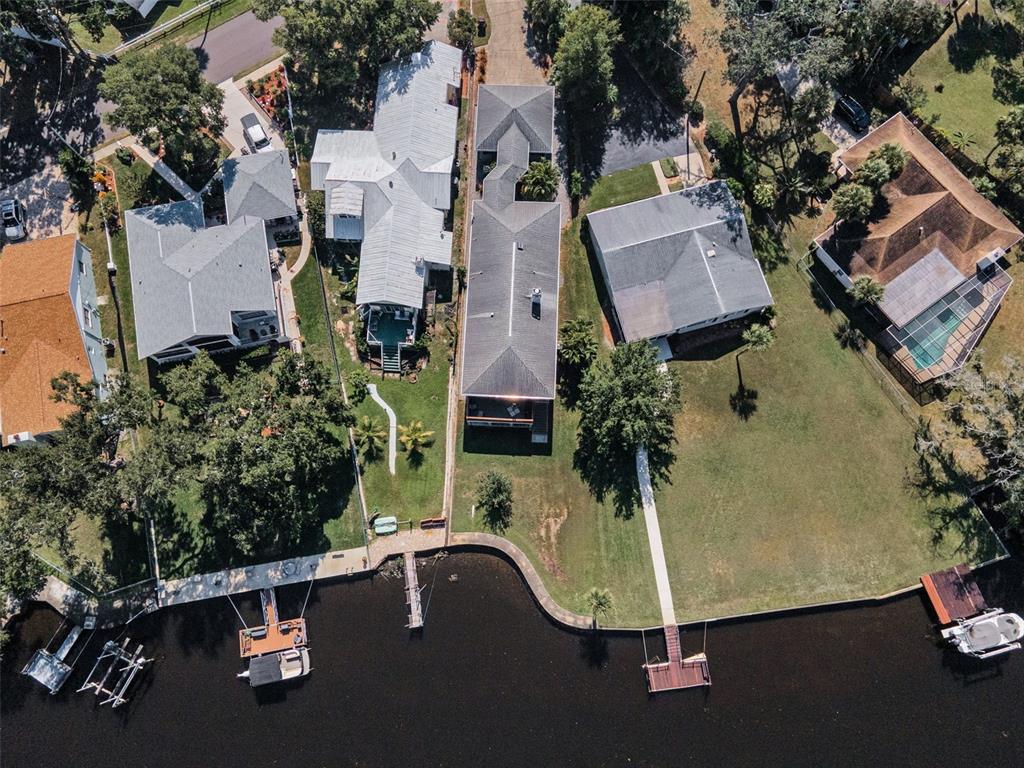 6141 Lafayette Street New Port Richey, FL 34652 - Photo 61 of 98 an aerial view of residential houses with outdoor space and parking