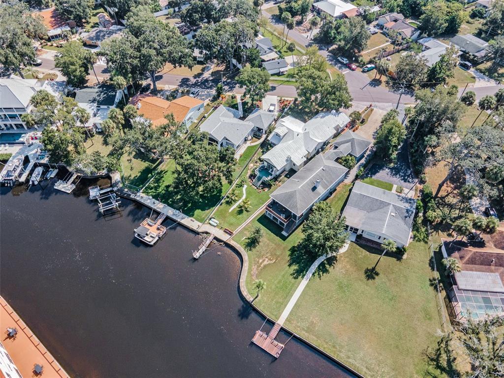 6141 Lafayette Street New Port Richey, FL 34652 - Photo 68 of 98 an aerial view of a house with a yard and lake