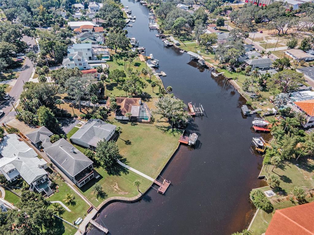 6141 Lafayette Street New Port Richey, FL 34652 - Photo 69 of 98 an aerial view of a house with a yard and lake view
