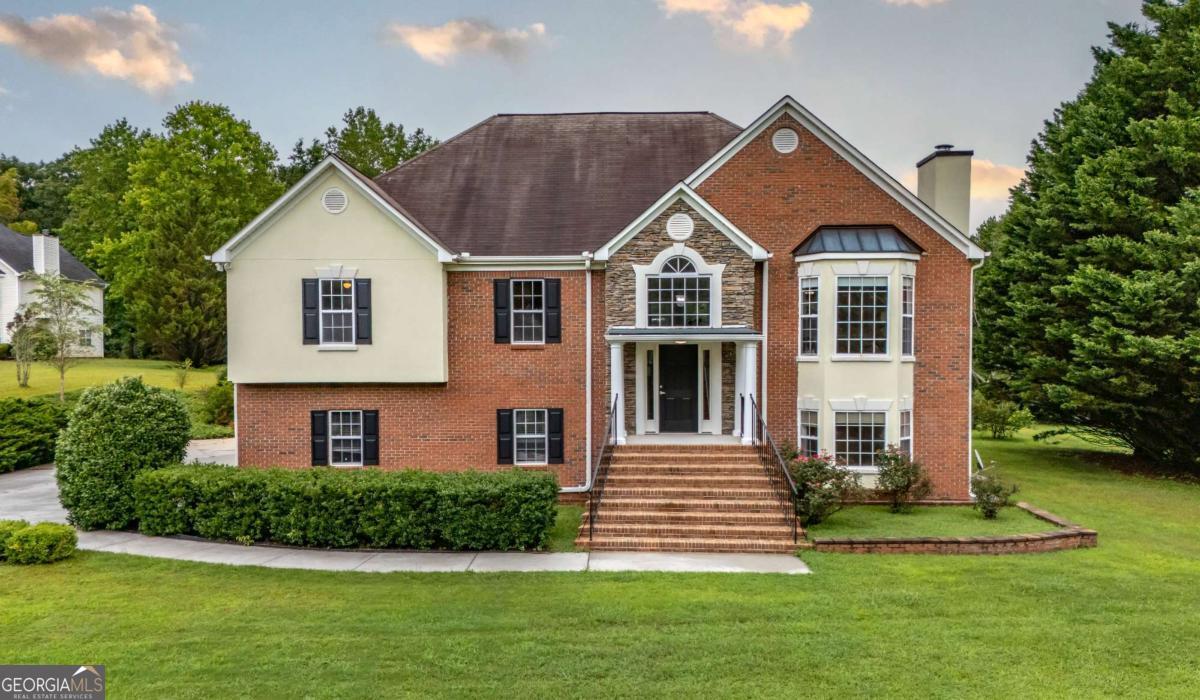 45 Buell Jones Road Carrollton, GA 30117 - Photo 15 of 60 a front view of a house with a yard