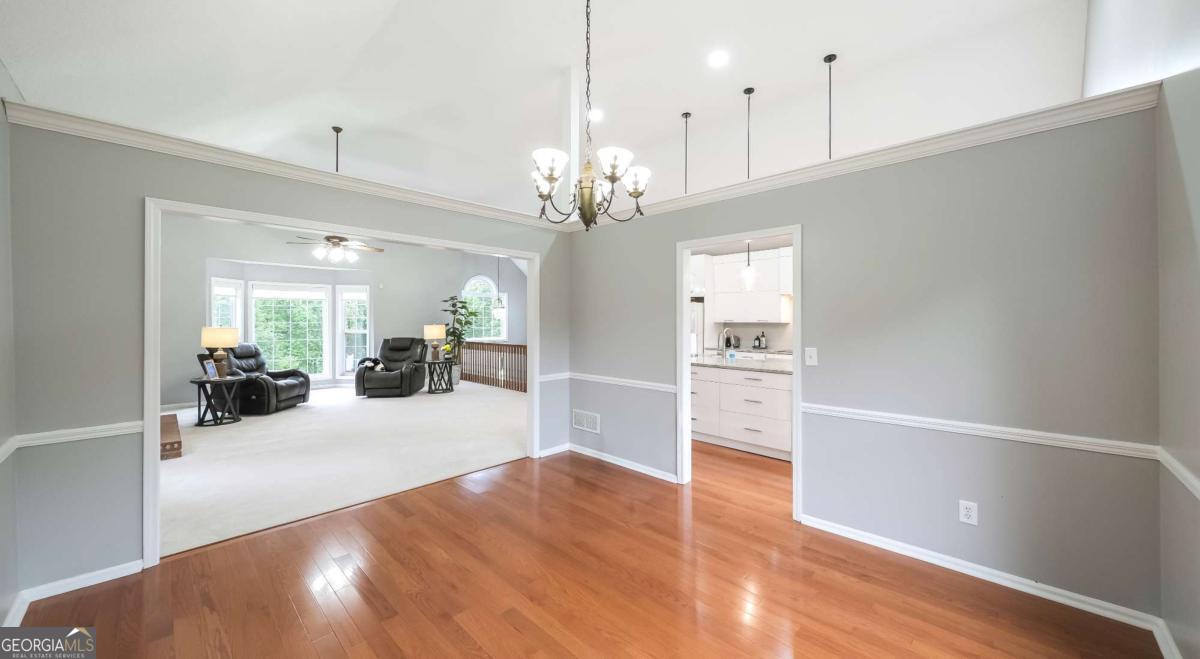 45 Buell Jones Road Carrollton, GA 30117 - Photo 18 of 60 a view of a livingroom with a furniture wooden floor kitchen chandelier and a living room