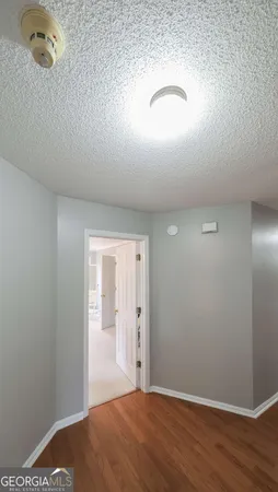 a bathroom with a bathtub a sink a window and a shower