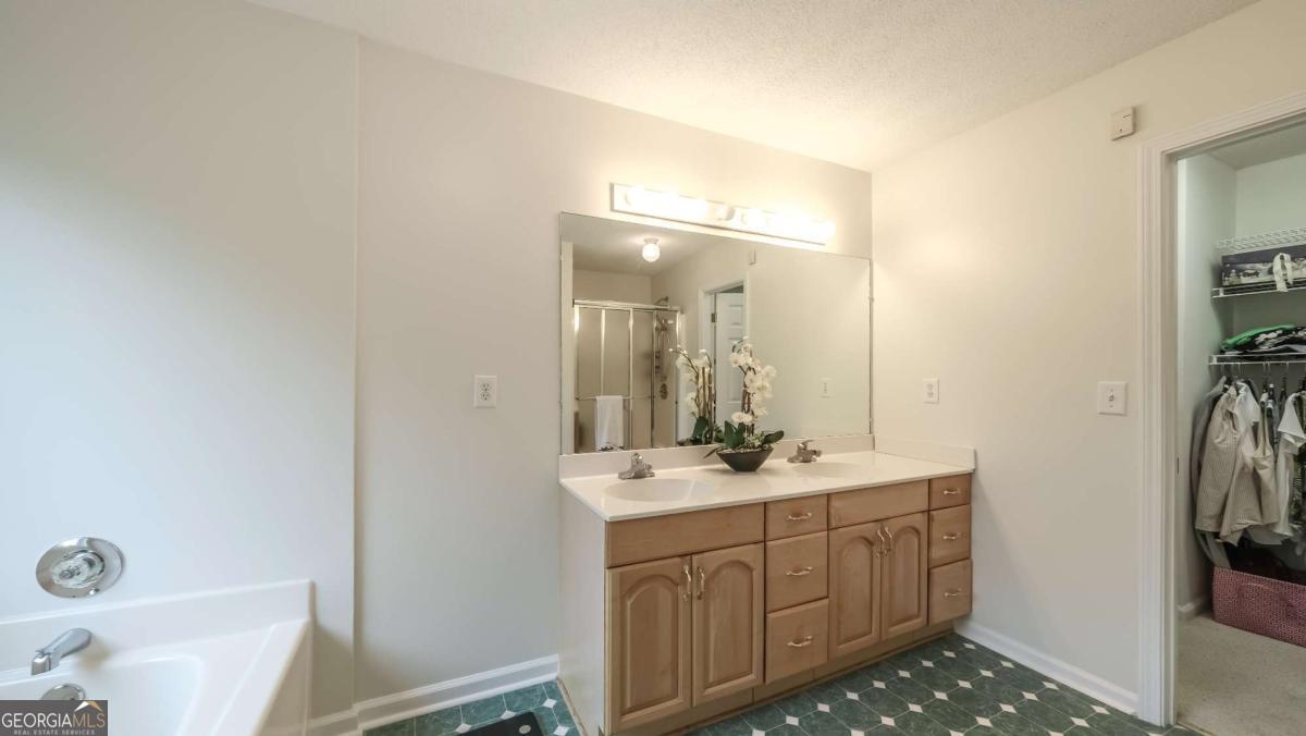 45 Buell Jones Road Carrollton, GA 30117 - Photo 25 of 60 a bathroom with a sink a toilet and shower