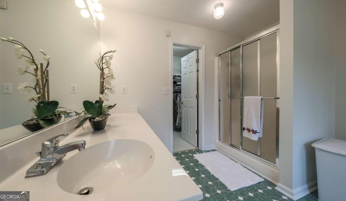 45 Buell Jones Road Carrollton, GA 30117 - Photo 26 of 60 a bathroom with a sink and a mirror