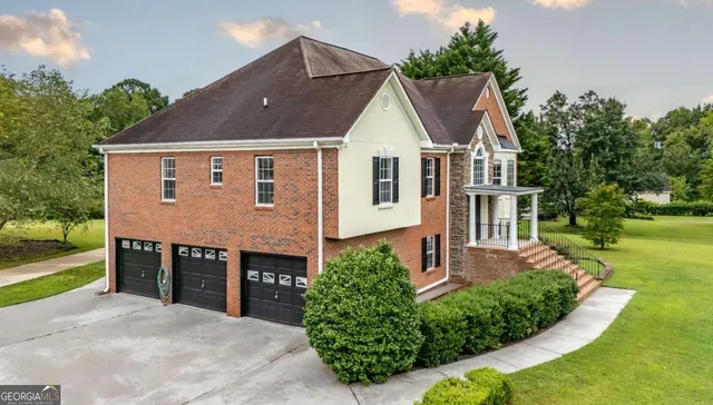 a front view of a house with a yard