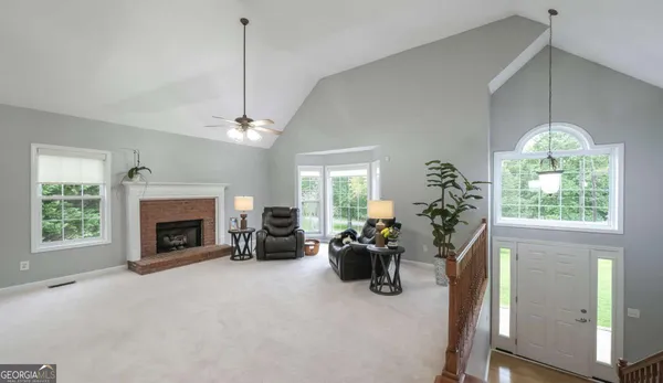 a bed room with furniture and a chandelier