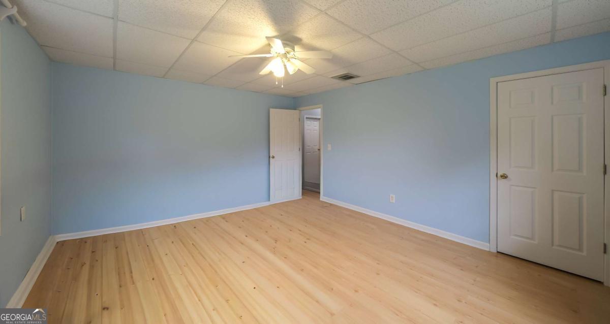 45 Buell Jones Road Carrollton, GA 30117 - Photo 40 of 60 a view of an empty room with a chandelier fan