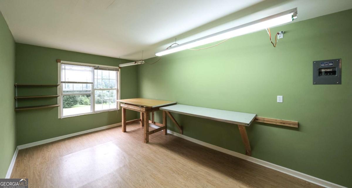 45 Buell Jones Road Carrollton, GA 30117 - Photo 47 of 60 a room with wooden floor and a window