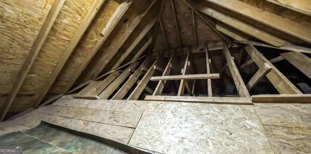 an aerial view of a houses with a yard