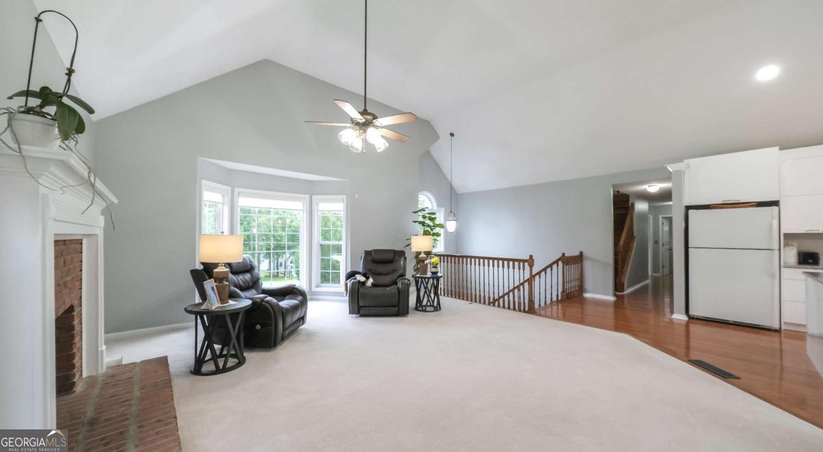 45 Buell Jones Road Carrollton, GA 30117 - Photo 8 of 60 a bed room with furniture and a chandelier