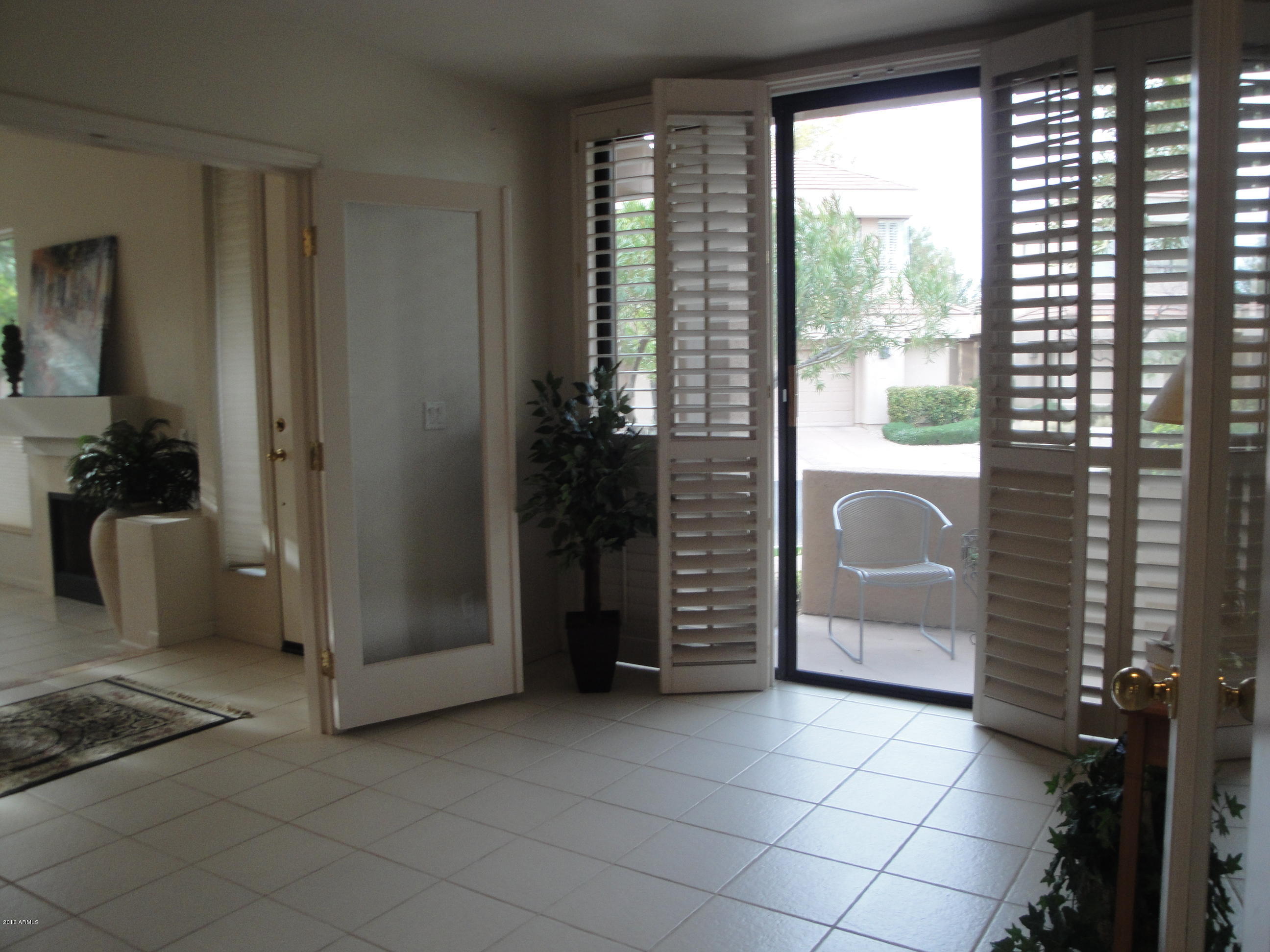 7222 East Gainey Ranch Road, Unit 114 Scottsdale, AZ 85258 - Photo 12 of 53 SLIDERS OUT TO PATIO FROM DEN