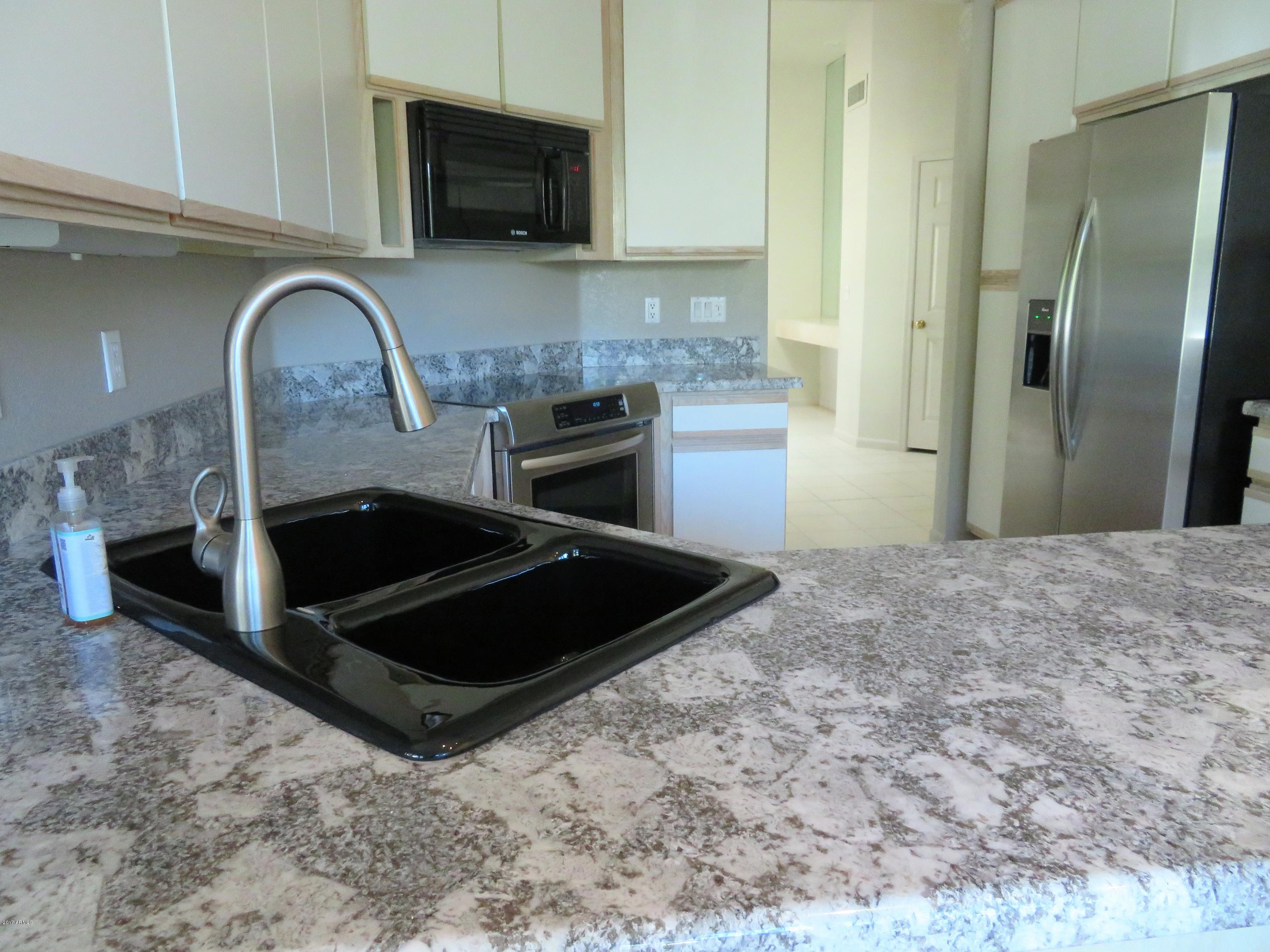 7222 East Gainey Ranch Road, Unit 114 Scottsdale, AZ 85258 - Photo 22 of 53 NEW FIXTURES IN KITCHEN