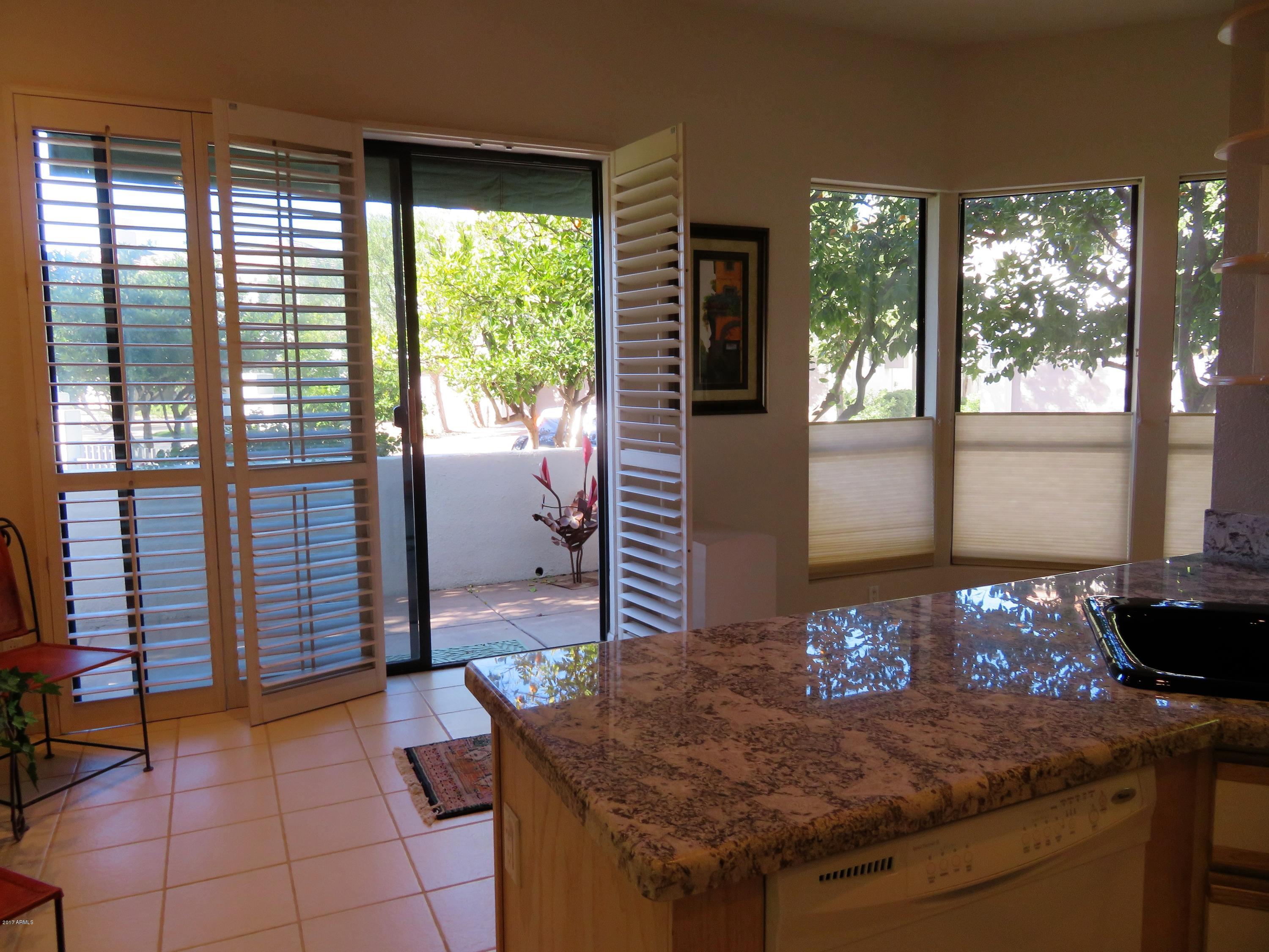 7222 East Gainey Ranch Road, Unit 114 Scottsdale, AZ 85258 - Photo 29 of 53 LUSH VIEWS FROM LIVING/KITCHEN