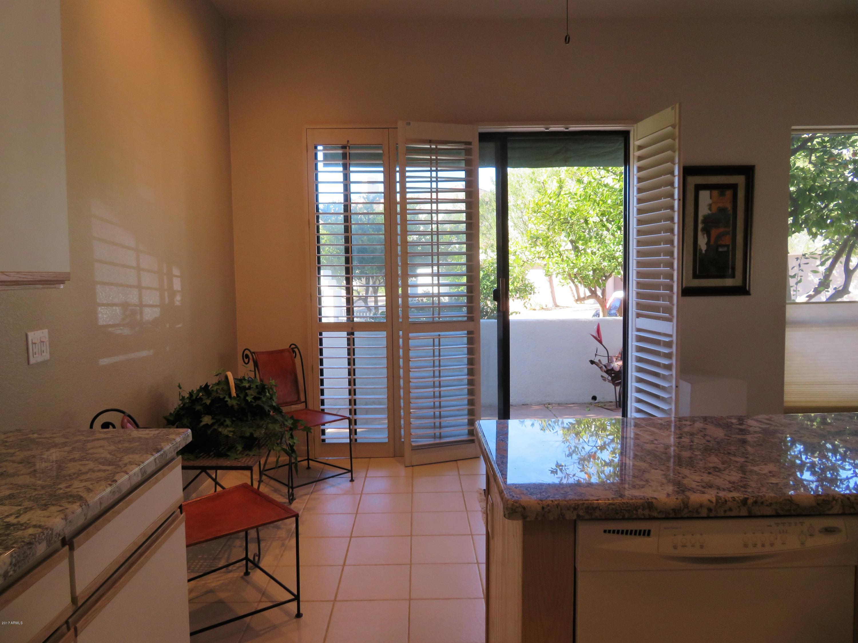 7222 East Gainey Ranch Road, Unit 114 Scottsdale, AZ 85258 - Photo 30 of 53 BREAKFAST ROOM AREA OFF KITCHEN