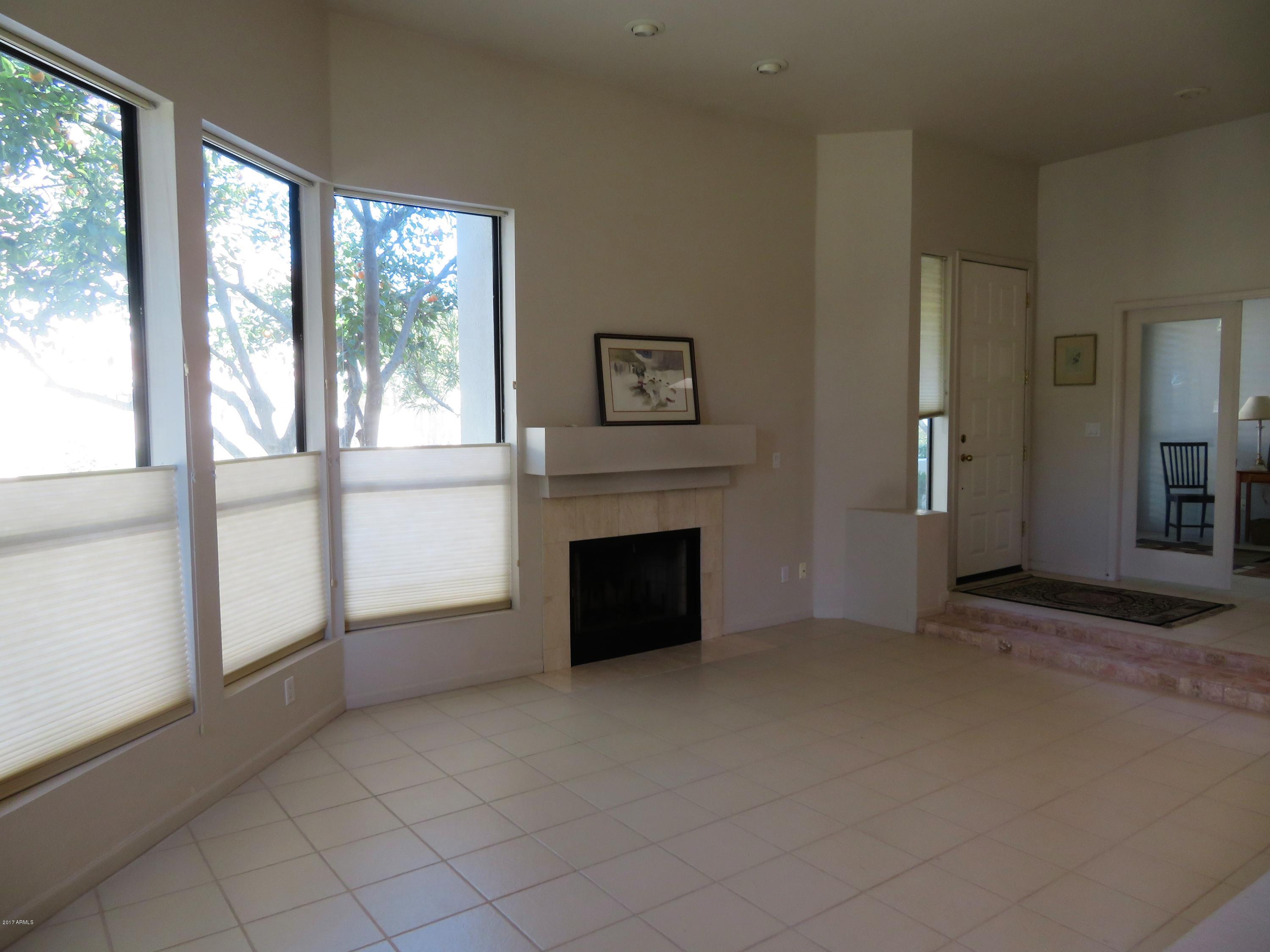 7222 East Gainey Ranch Road, Unit 114 Scottsdale, AZ 85258 - Photo 9 of 53 WOOD BURNING FIREPLACE
