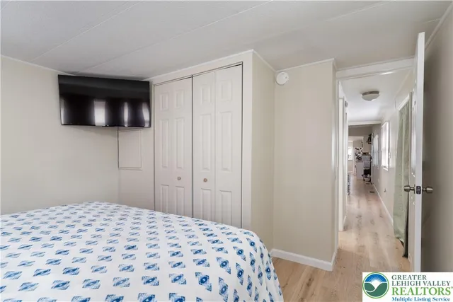 a bedroom with a bed and a view of bathroom